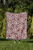 Dandelion Floral Cotton Throw Blanket in Red, outdoors