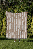 Deka Abstract Cotton Throw Blanket in Beige, outdoors