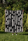 Deka Abstract Cotton Throw Blanket in Black, outdoors