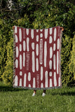 Deka Abstract Cotton Throw Blanket in Red, outdoors