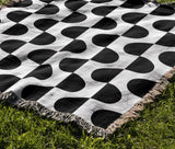 Demi Geometric Cotton Throw Blanket in Black, outdoors