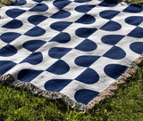Demi Geometric Cotton Throw Blanket in Blue, outdoors