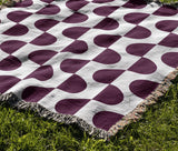 Demi Geometric Cotton Throw Blanket in Purple, outdoors