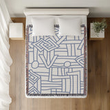 Diof Abstract Print Cotton Throw Blanket in Light Blue, on a bed