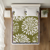 Fiesta Floral Cotton Throw Blanket in Chartreuse, on a bed
