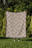 Hami Cotton Throw Blanket in Beige, outdoors