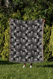 Hami Cotton Throw Blanket in Black, outdoors