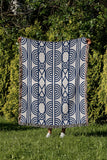 Idia Geometric Cotton Throw Blanket in Blue, outdoors