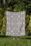 Idia Geometric Cotton Throw Blanket in Gray, outdoors