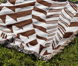 Kafi Abstract Cotton Throw Blanket in Rust Brown, outdoors