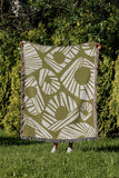 Kio Abstract Print Cotton Throw Blanket in Chartreuse, outdoors