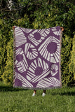 Kio Abstract Print Cotton Throw Blanket in Purple, outdoors