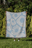 Kio Abstract Print Cotton Throw Blanket in Sky, outdoors
