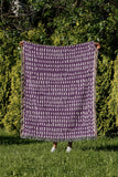 Kola Abstract Print Cotton Throw Blanket in Purple, outdoors