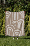 Lyno Abstract Print Cotton Throw Blanket in Beige, outdoors