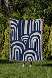 Lyno Abstract Print Cotton Throw Blanket in Blue, outdoors