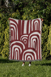 Lyno Abstract Print Cotton Throw Blanket in Red, outdoors