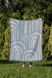 Lyno Abstract Print Cotton Throw Blanket in Sky, outdoors