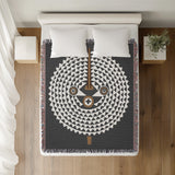 Mossi African Mask 100% Cotton Blanket in Gray, on a bed