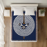 Mossi African Mask 100% Cotton Blanket in Navy Blue, on a bed