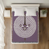 Mossi African Mask 100% Cotton Blanket in Purple, on a bed