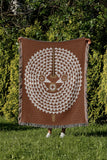 Mossi African Mask 100% Cotton Blanket in Rust Brown, outdoors