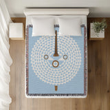 Mossi African Mask 100% Cotton Blanket in Sky Blue, on a bed