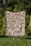 Nami Abstract Floral Blanket Throw in Beige, outdoors