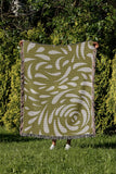 Nami Abstract Floral Blanket Throw in Chartreuse, outdoors
