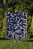 Nami Abstract Floral Blanket Throw in Navy Blue, outdoors