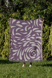 Nami Abstract Floral Blanket Throw in Purple, outdoors