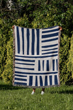 Pereto Abstract Print Cotton Throw Blanket in Blue, outdoors