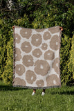 Poppi Floral Cotton Throw Blanket in Beige, outdoors