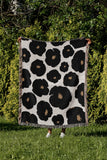 Poppi Floral Cotton Throw Blanket in Black, outdoors