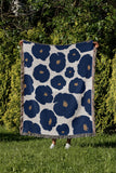 Poppi Floral Cotton Throw Blanket in Blue, outdoors