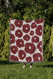 Poppi Floral Cotton Throw Blanket in Red, outdoors