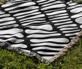 Pyro Abstract Print Cotton Throw Blanket in Black, outdoors