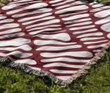 Pyro Abstract Print Cotton Throw Blanket in Red, outdoors