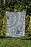 Ray Abstract Print Cotton Throw Blanket in Teal, outdoors