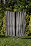 River Striped Cotton Throw Blanket in Black, outdoors