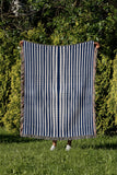 River Striped Cotton Throw Blanket in Blue, outdoors