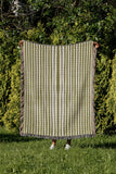 River Striped Cotton Throw Blanket in Chartreuse, outdoors
