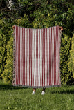River Striped Cotton Throw Blanket in Red, outdoors