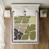 Roni Floral Cotton Throw Blanket in Chartreuse, on a bed