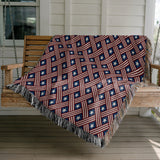 Stars and Stripes Day Cotton Throw Blanket, draped over a sofa