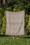 Thora Tribal Cotton Throw Blanket in Beige, outdoors
