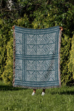 Thora Tribal Cotton Throw Blanket in Teal, outdoors