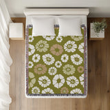 Valu Floral Cotton Throw Blanket in Chartreuse, on a bed