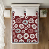 Valu Floral Cotton Throw Blanket in Red, on a bed