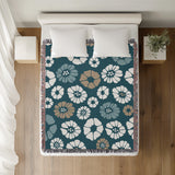 Valu Floral Cotton Throw Blanket in Teal, on a bed